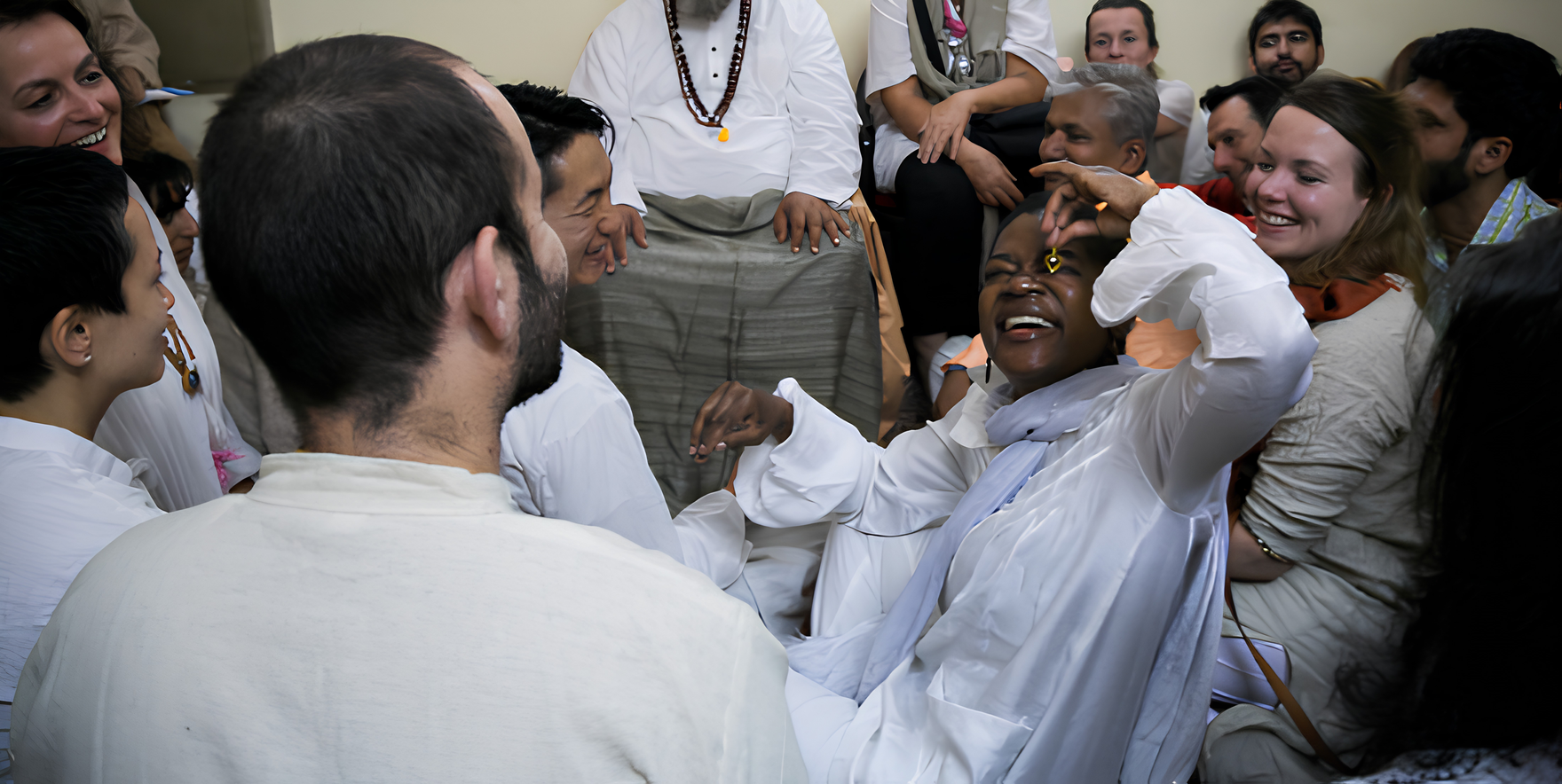 Dr. Blossom A. Burton laughing among a contemplative gathering in India